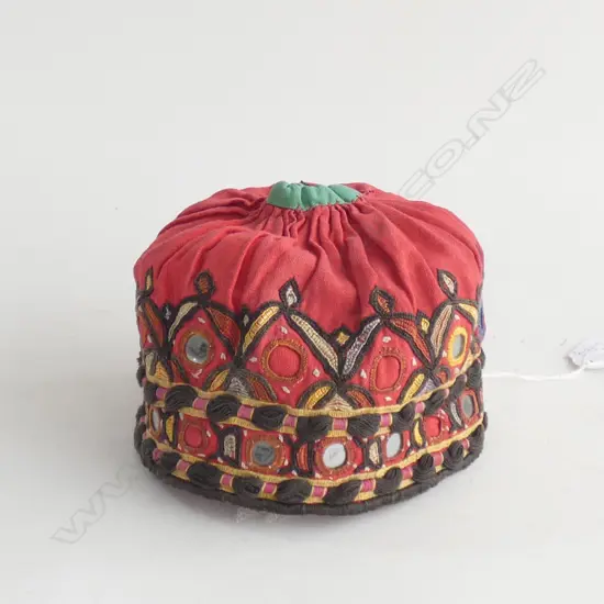 A shisha embroidered baby’s cap, Rajasthan, India.
